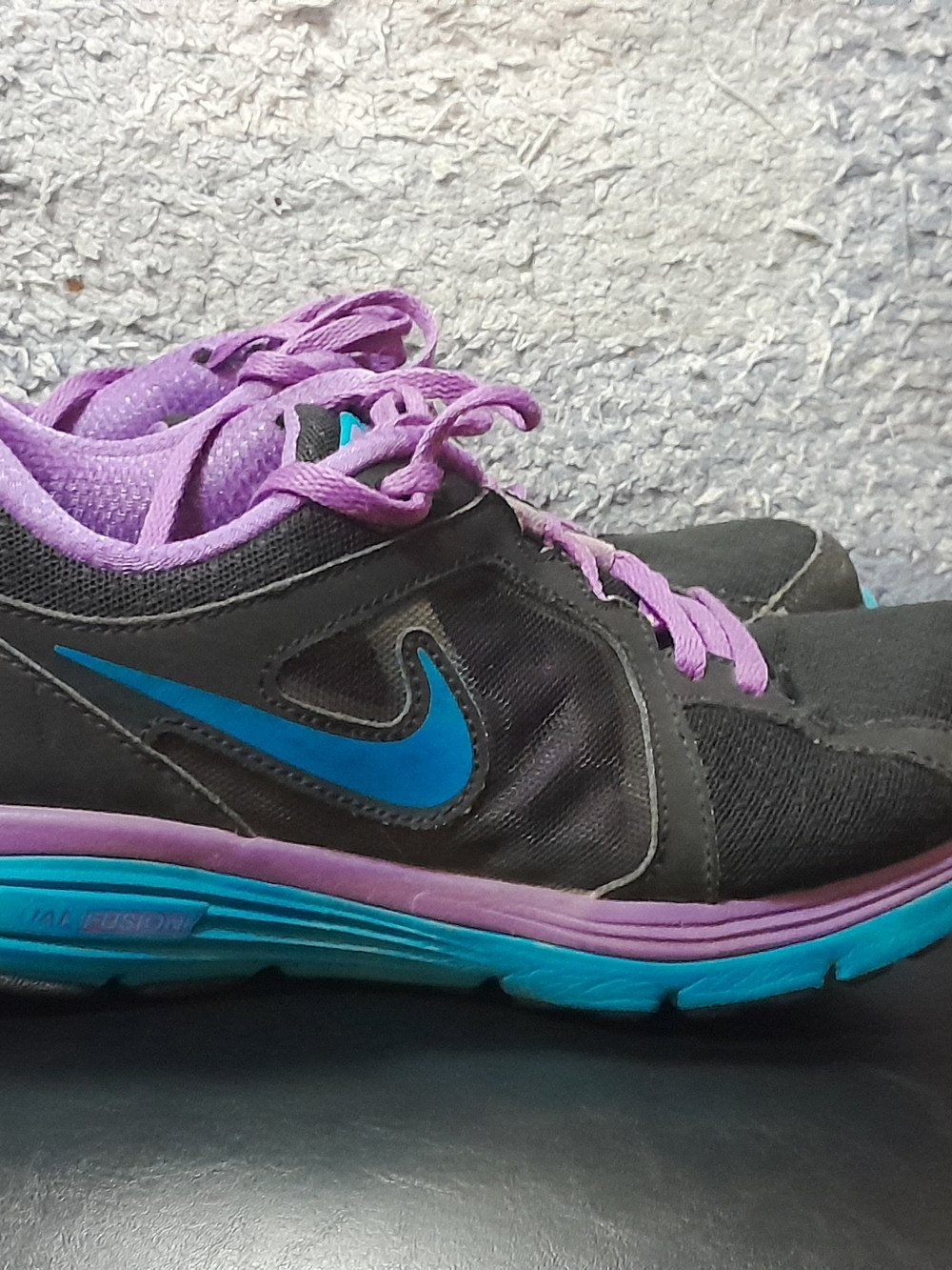 Nike Women’s Black Sneakers with Purple Lining and Blue Swoosh